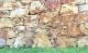 Mediterraner Garten: Steine in warmen Rottönen