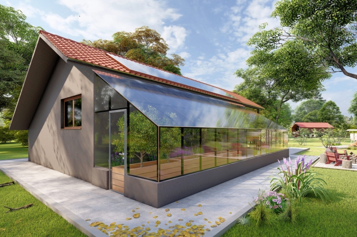 ein braunes Haus mit überdachter Terrasse und angebautem Gewächsgarten